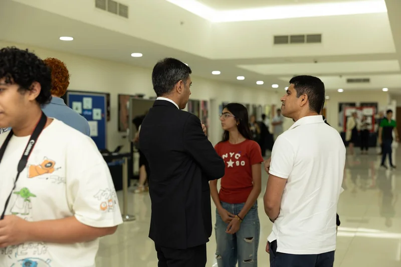 A young person speaking with professionals at a YOUthConnect event