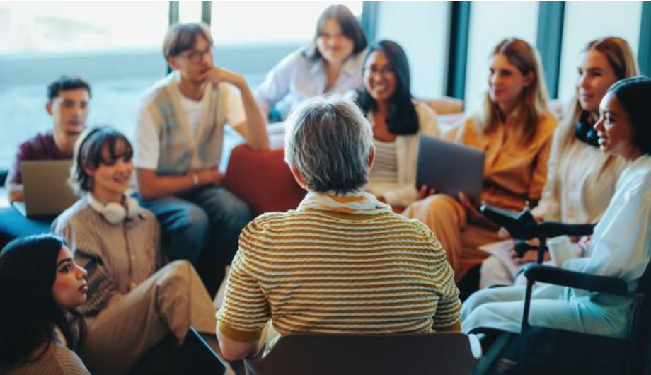 Young people taking part in a group mentoring discussion.