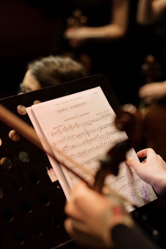 Orchestral sheet music during a live music performance.