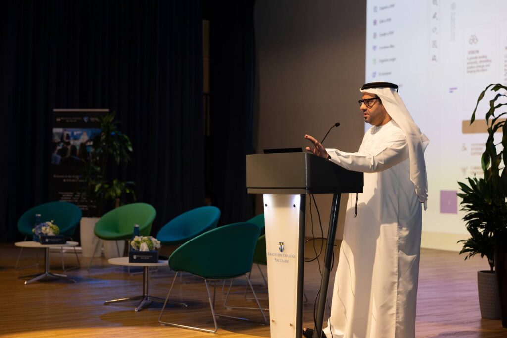 A speaker addresses the room from the podium during a past forum session.