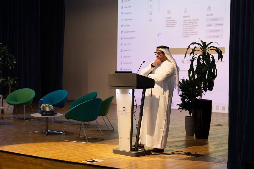 A keynote speaker pauses at the podium during the forum programme.