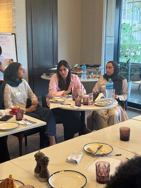 Students share perspectives during a focused round-table moment.