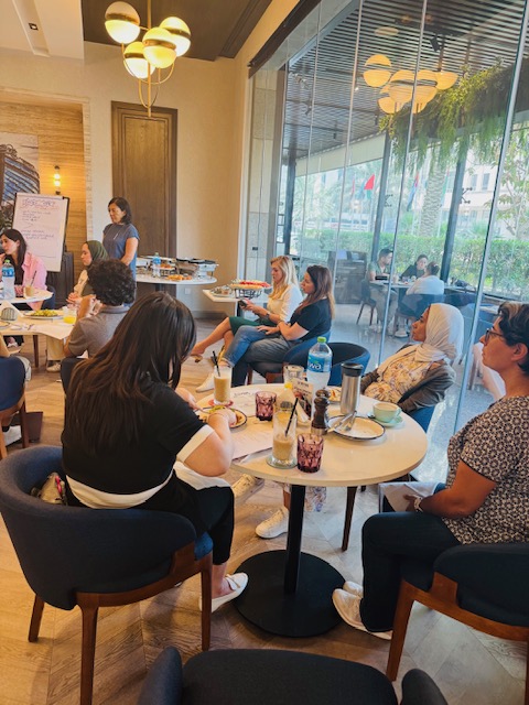 Attendees listen as a facilitator guides the discussion.