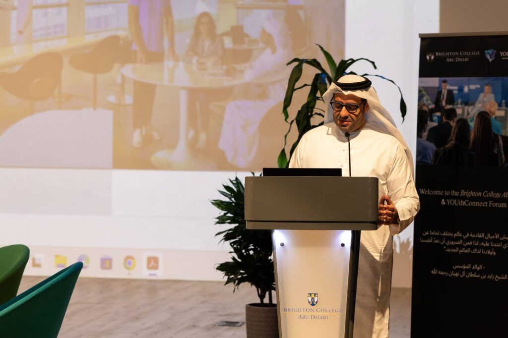 A speaker presents from the Brighton College Abu Dhabi podium at a previous forum.