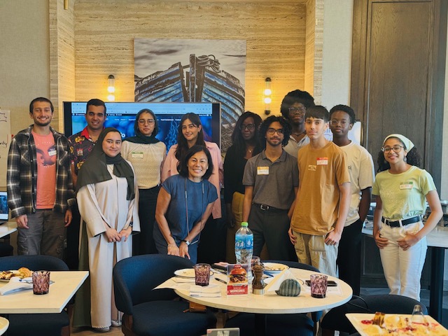 Participants and facilitators gather for a group photo after a YOUthConnect session.