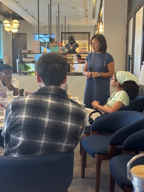 A facilitator speaks with participants during the forum workshop.